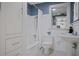 Bathroom featuring black and white tile, a pedestal sink, and a shower-tub combo with white tiled walls at 445 13Th Ne Ave, St Petersburg, FL 33701
