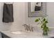 Close up of a bathroom vanity with granite countertop and modern, brushed nickel faucet at 445 13Th Ne Ave, St Petersburg, FL 33701