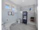 Light and airy bathroom featuring gray tile floors, a bidet, and a modern, glass-enclosed shower at 445 13Th Ne Ave, St Petersburg, FL 33701