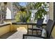 Cozy front porch with comfortable seating, perfect for relaxing and enjoying the neighborhood's peaceful ambiance at 445 13Th Ne Ave, St Petersburg, FL 33701