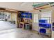 Well-organized garage featuring ample shelving, work bench, and convenient storage solutions to maximize space at 445 13Th Ne Ave, St Petersburg, FL 33701