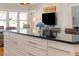 Open concept living room with a kitchen island and barstool seating and a view to the living room at 445 13Th Ne Ave, St Petersburg, FL 33701
