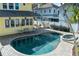 An aerial view of the backyard pool, patio and outdoor seating area at 445 13Th Ne Ave, St Petersburg, FL 33701