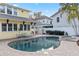 Backyard pool with patio and spa featuring lush landscaping and plenty of room for entertaining at 445 13Th Ne Ave, St Petersburg, FL 33701