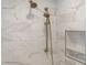 Shower showcasing multiple shower heads, white marble tile and a built-in shelving niche at 445 13Th Ne Ave, St Petersburg, FL 33701