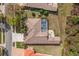 Aerial view of the property showcasing the pool, backyard, roof, and surrounding landscape at 4564 Juniper Dr, Palm Harbor, FL 34685