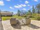 A cozy backyard with a fire pit and comfortable seating, creating an inviting outdoor space at 4564 Juniper Dr, Palm Harbor, FL 34685