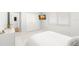 Clean bedroom with neutral color palette and large window for natural light at 4564 Juniper Dr, Palm Harbor, FL 34685