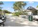 Lansbrook Golf Course Clubhouse featuring covered entrance, steps and golf carts at 4564 Juniper Dr, Palm Harbor, FL 34685