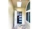 View of hallway featuring skylight and storage space, as well as exterior door at 4564 Juniper Dr, Palm Harbor, FL 34685