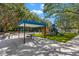 Playground featuring picnic tables, vibrant play structures, and artificial turf at 4564 Juniper Dr, Palm Harbor, FL 34685