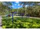 A large, inviting playground features multiple play areas and lush green turf at 4564 Juniper Dr, Palm Harbor, FL 34685