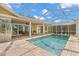 A spacious backyard featuring a pristine pool, perfect for relaxation and outdoor entertainment at 4564 Juniper Dr, Palm Harbor, FL 34685