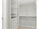 Organized walk-in closet with built-in shelving and drawers for ample storage space at 4564 Juniper Dr, Palm Harbor, FL 34685