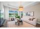 Cozy living room with a modern sofa, soft rug, and natural light, creating a perfect relaxing space at 4571 Cedron Ct, Sarasota, FL 34240