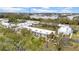 Scenic aerial view displays residential complex with lush greenery and meticulously maintained landscaping at 4647 Lake Villa Dr, Clearwater, FL 33762