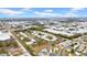 Expansive aerial view showcases the community's layout, surrounded by commercial businesses and mature trees at 4647 Lake Villa Dr, Clearwater, FL 33762