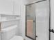 Bathroom featuring a shower stall, white walls and toilet at 4647 Lake Villa Dr, Clearwater, FL 33762
