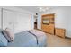 Bedroom with hardwood floors, ceiling fan and a double closet at 4647 Lake Villa Dr, Clearwater, FL 33762