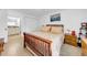 Bedroom with hardwood floors, a wooden bed, and white walls at 4647 Lake Villa Dr, Clearwater, FL 33762