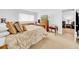 Bright bedroom featuring a large window, wooden floors and furniture at 4647 Lake Villa Dr, Clearwater, FL 33762