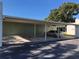 Carport area with parking spaces covered by a metal awning at 4647 Lake Villa Dr, Clearwater, FL 33762