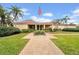 Exterior of the community clubhouse at The Lakes offers well-maintained landscaping and easy access for residents at 4647 Lake Villa Dr, Clearwater, FL 33762