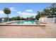 Community pool with brick paver patio offers a refreshing outdoor space for relaxation and recreation at 4647 Lake Villa Dr, Clearwater, FL 33762