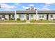 Attractive single-story townhome exteriors boasting neatly manicured lawns and individual walkways at 4647 Lake Villa Dr, Clearwater, FL 33762