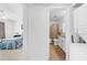 Hallway view of bedroom, bathroom and stackable washer/dryer at 4647 Lake Villa Dr, Clearwater, FL 33762