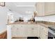 Kitchen with granite countertops and stainless steel sink overlooking the living area at 4647 Lake Villa Dr, Clearwater, FL 33762