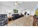 Living room with barstool seating at the kitchen counter at 4647 Lake Villa Dr, Clearwater, FL 33762