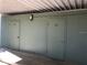 Storage units with doors under a metal awning at 4647 Lake Villa Dr, Clearwater, FL 33762