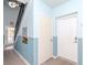 Well-lit hallway with neutral colors and easy access to stairwell at 4816 Snook Se Dr # A, St Petersburg, FL 33705