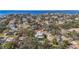 An aerial view showing residential homes in a neighborhood setting with a view of the tranquil waterfront at 5010 W Dickens Ave, Tampa, FL 33629