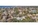 An aerial view of a picturesque neighborhood dotted with homes, trees and the sparkling water at 5010 W Dickens Ave, Tampa, FL 33629