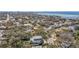 An aerial view showcasing a beautiful coastal neighborhood and homes with a stunning ocean backdrop at 5010 W Dickens Ave, Tampa, FL 33629