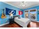 Bedroom with sports decor and hardwood floors at 5010 W Dickens Ave, Tampa, FL 33629