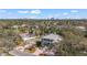 A charming home featuring a classic design with a welcoming porch, set against the backdrop of the city skyline at 5010 W Dickens Ave, Tampa, FL 33629