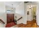 Entryway with detailed wooden doors, hardwood floors and stairway access to the second floor at 5010 W Dickens Ave, Tampa, FL 33629