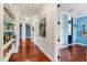 Hallway with bookshelves and access to other rooms at 5010 W Dickens Ave, Tampa, FL 33629