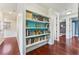Hallway featuring built-in bookshelves at 5010 W Dickens Ave, Tampa, FL 33629