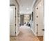 Hallway leading to a bedroom featuring patterned carpet and neutral paint at 5010 W Dickens Ave, Tampa, FL 33629