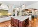 Bright kitchen featuring a marble island, stainless steel appliances, and decorative tile backsplash at 5010 W Dickens Ave, Tampa, FL 33629