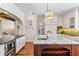 Kitchen featuring a marble island with a sink, wine cooler, and stainless steel appliances at 5010 W Dickens Ave, Tampa, FL 33629