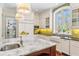 Bright kitchen with modern appliances, a farmhouse sink, and a large window at 5010 W Dickens Ave, Tampa, FL 33629