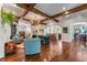 Spacious living room with beautiful wood floors, beamed ceilings, and lots of natural light at 5010 W Dickens Ave, Tampa, FL 33629