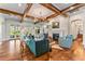 Bright and open living room with hardwood floors, fireplace, and access to the outdoor area at 5010 W Dickens Ave, Tampa, FL 33629