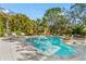 Inviting backyard pool with comfortable lounge chairs and beautifully landscaped surroundings at 5010 W Dickens Ave, Tampa, FL 33629