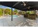 Resort-style pool area with a bar and ample seating options surrounded by lush tropical foliage at 5010 W Dickens Ave, Tampa, FL 33629